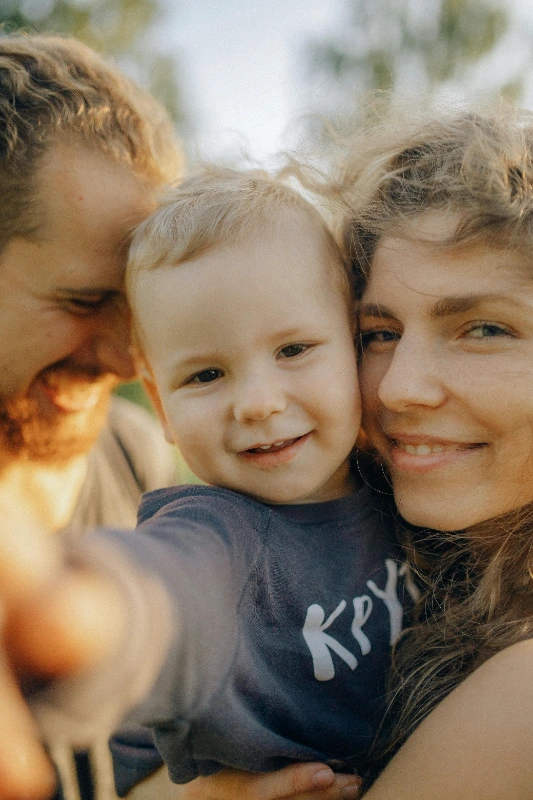 A happy family smiling after their dental appointment at our Roslyn, NY clinic.